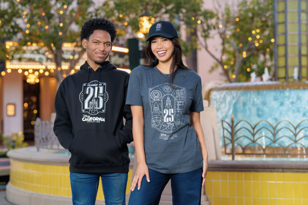 Man and woman modeling 25th anniversary merchandise at Disney California Adventure