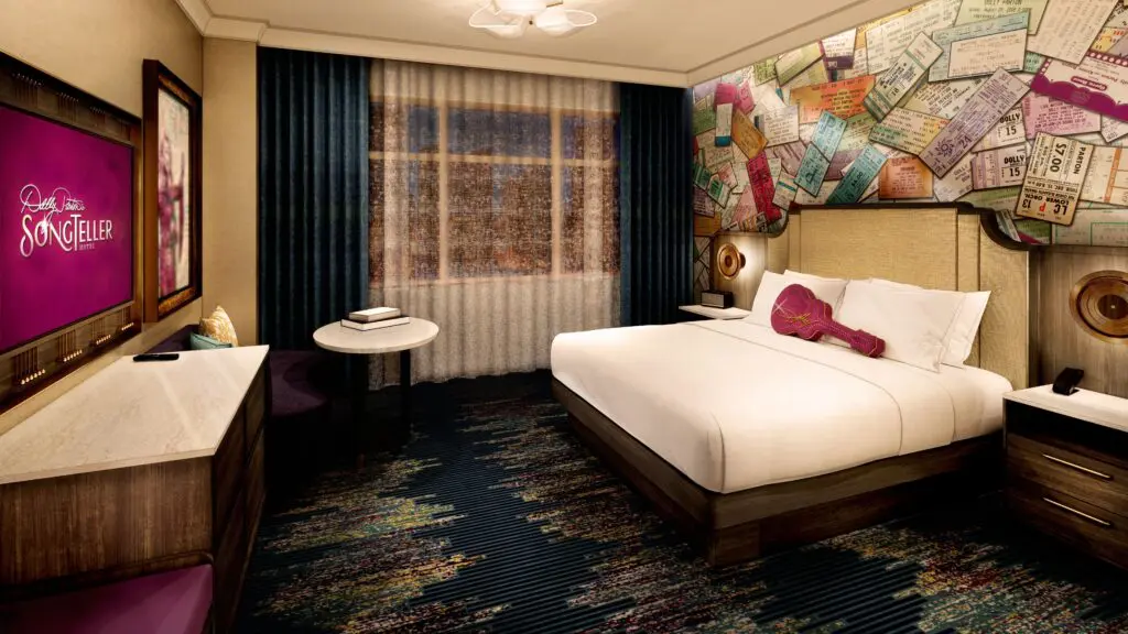A rendering of a guest room at Dolly Parton’s SongTeller Hotel with a guitar-shaped pillow on the bed