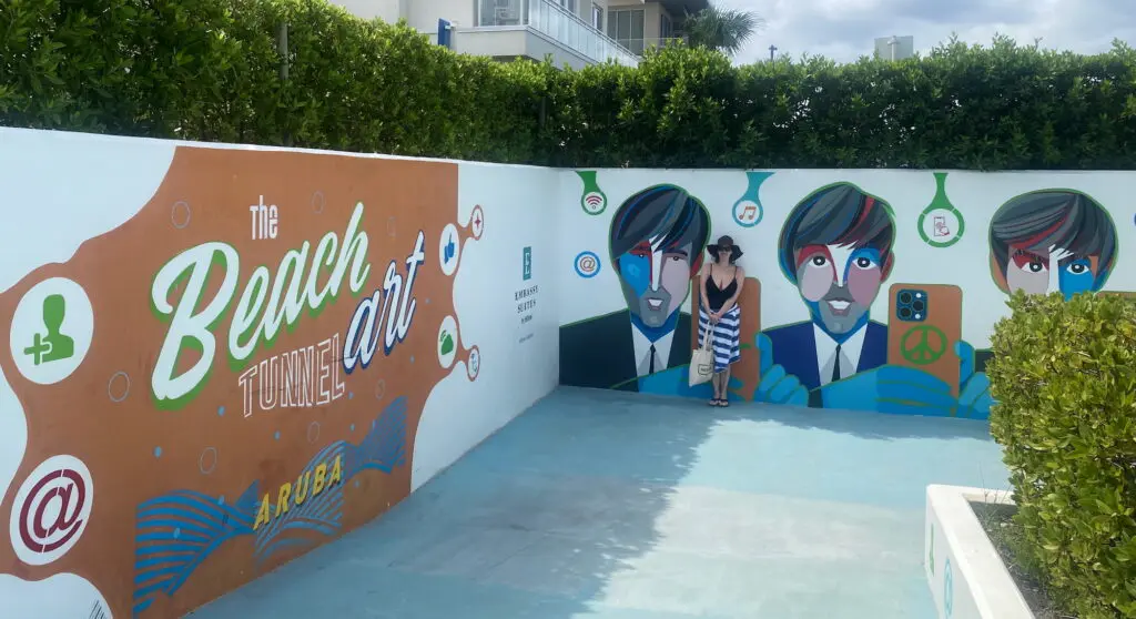 mural tunnel leading from the Embassy Suites Aruba Resort to the beach
