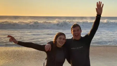 Teens after a sunrise surfing lesson in Hawaii