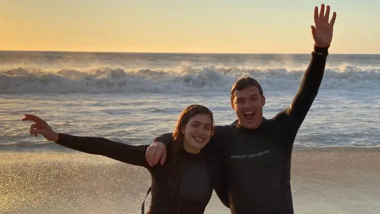 Teens after a sunrise surfing lesson in Hawaii