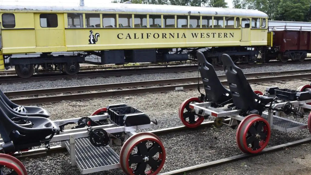 Skunk Trail Railcoaster Railbikes with train in background