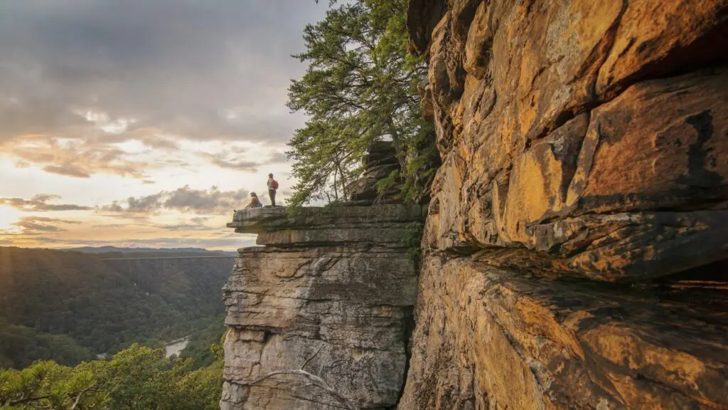 Two people at a lookout on the Endless Wall Trail at New River Gorge National Park