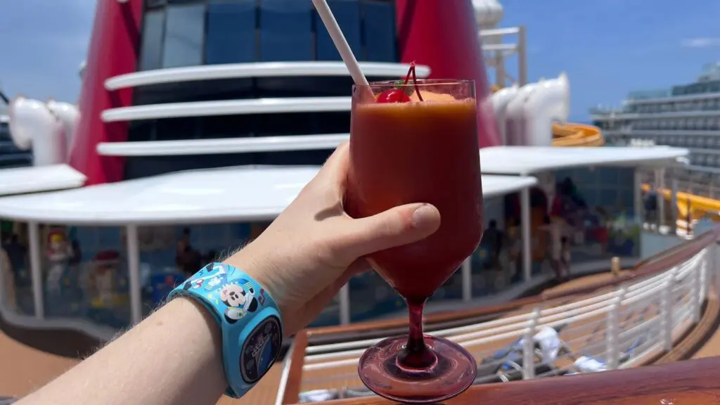 Kayla Voigt holding up a drink on the Disney Wish