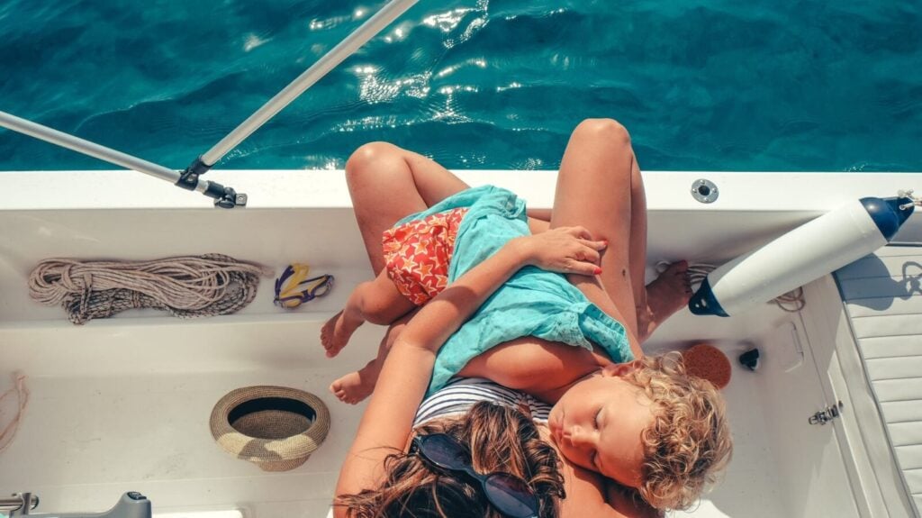 Sleeping baby on a boat (Photo: Nikola Radojcic on Unsplash)