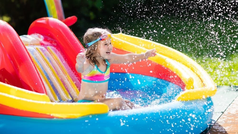 Child in inflatable pool (Photo: FamVeld/Shutterstock)
