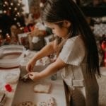child making Christmas cookies