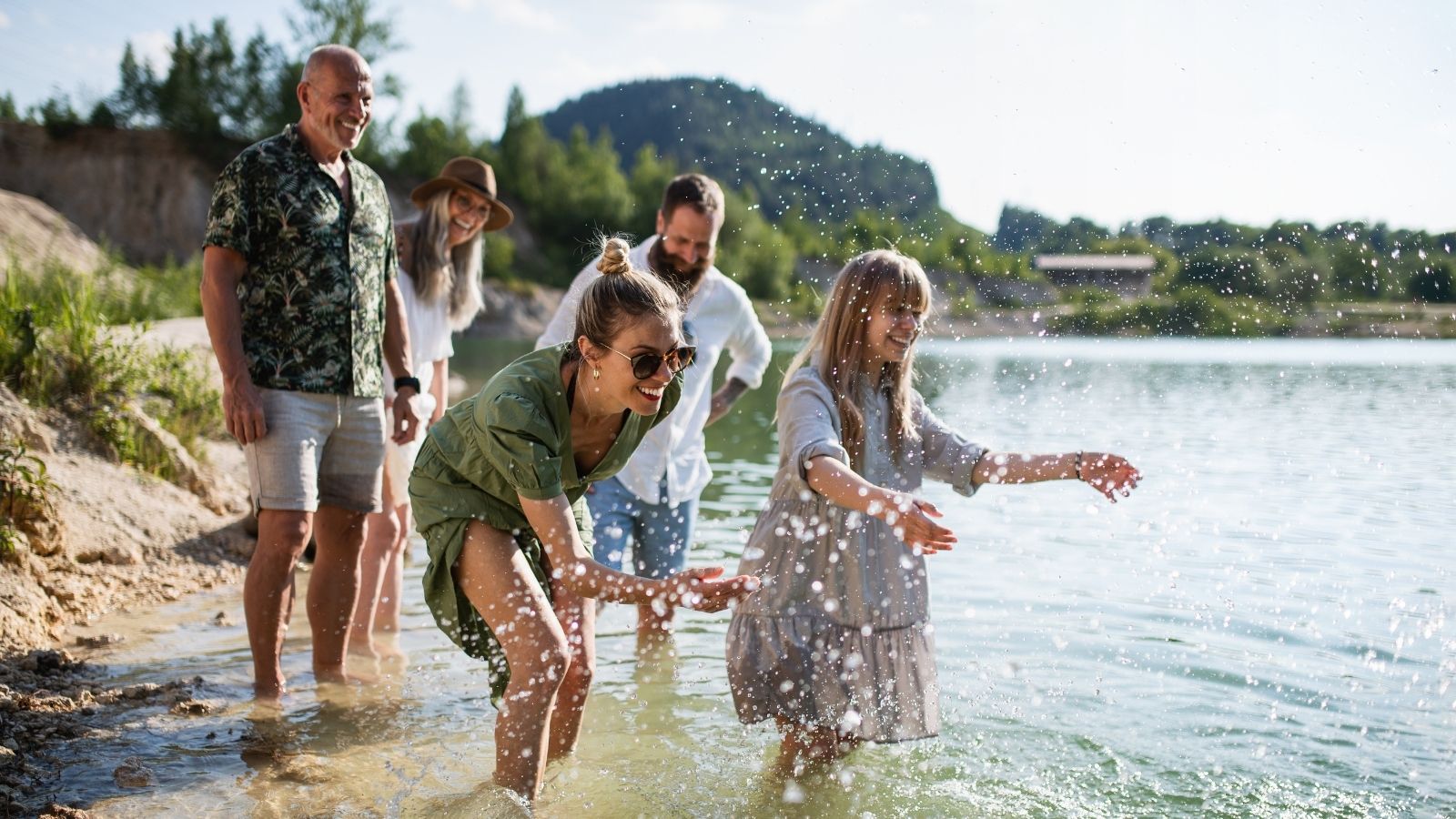 Multigenerational family on walk by lake (Photo: Shutterstock)