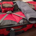 set of packing cubes in a suitcase