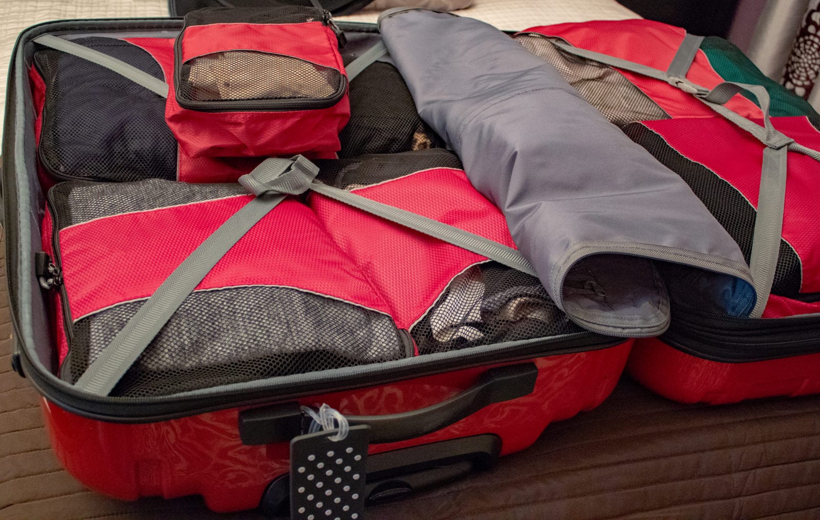 set of packing cubes in a suitcase