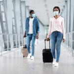 Man and woman in safety masks at airport