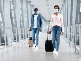 Man and woman in safety masks at airport