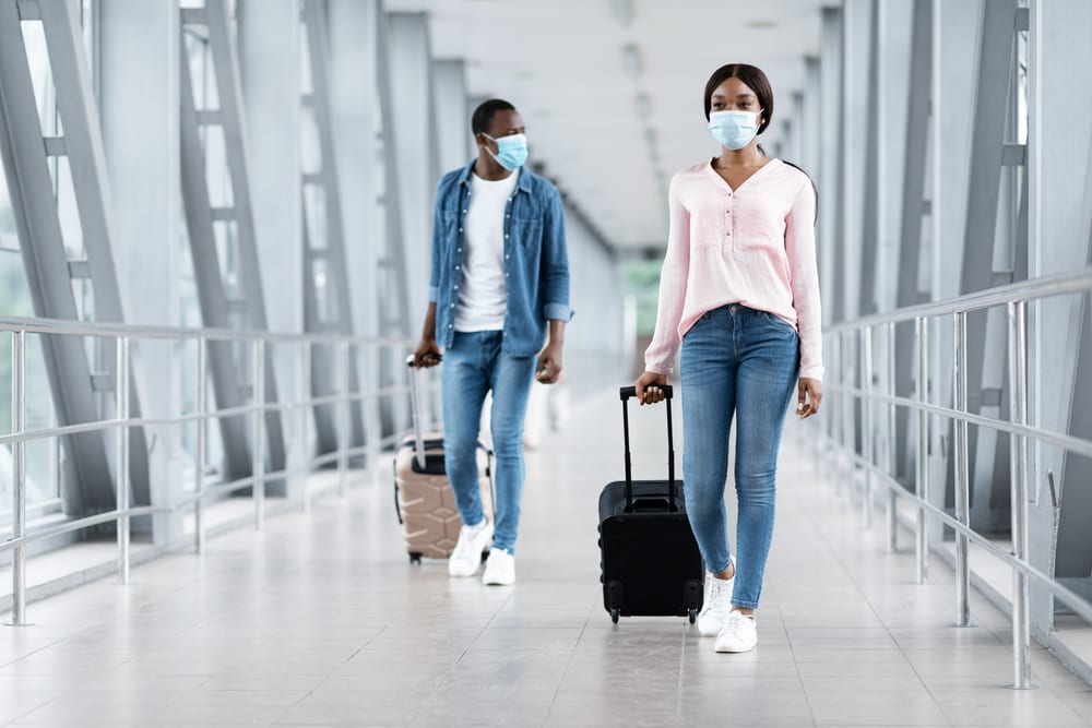 Man and woman in safety masks at airport