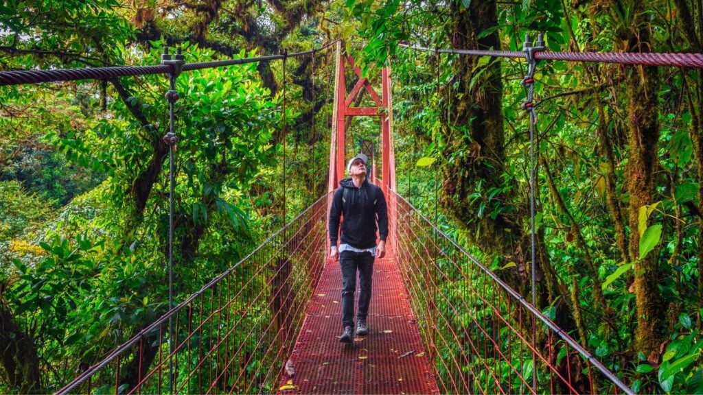 Tourist walking on a hanging suspension bridge Costa Rica's Monteverde Cloud Forest (Photo: Shutterstock)