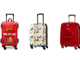 Three Disney luggage pieces: Cars 3 Lightning McQueen carry-on, Mickey Mouse suitcase, and Iron Man hardsided suitcase