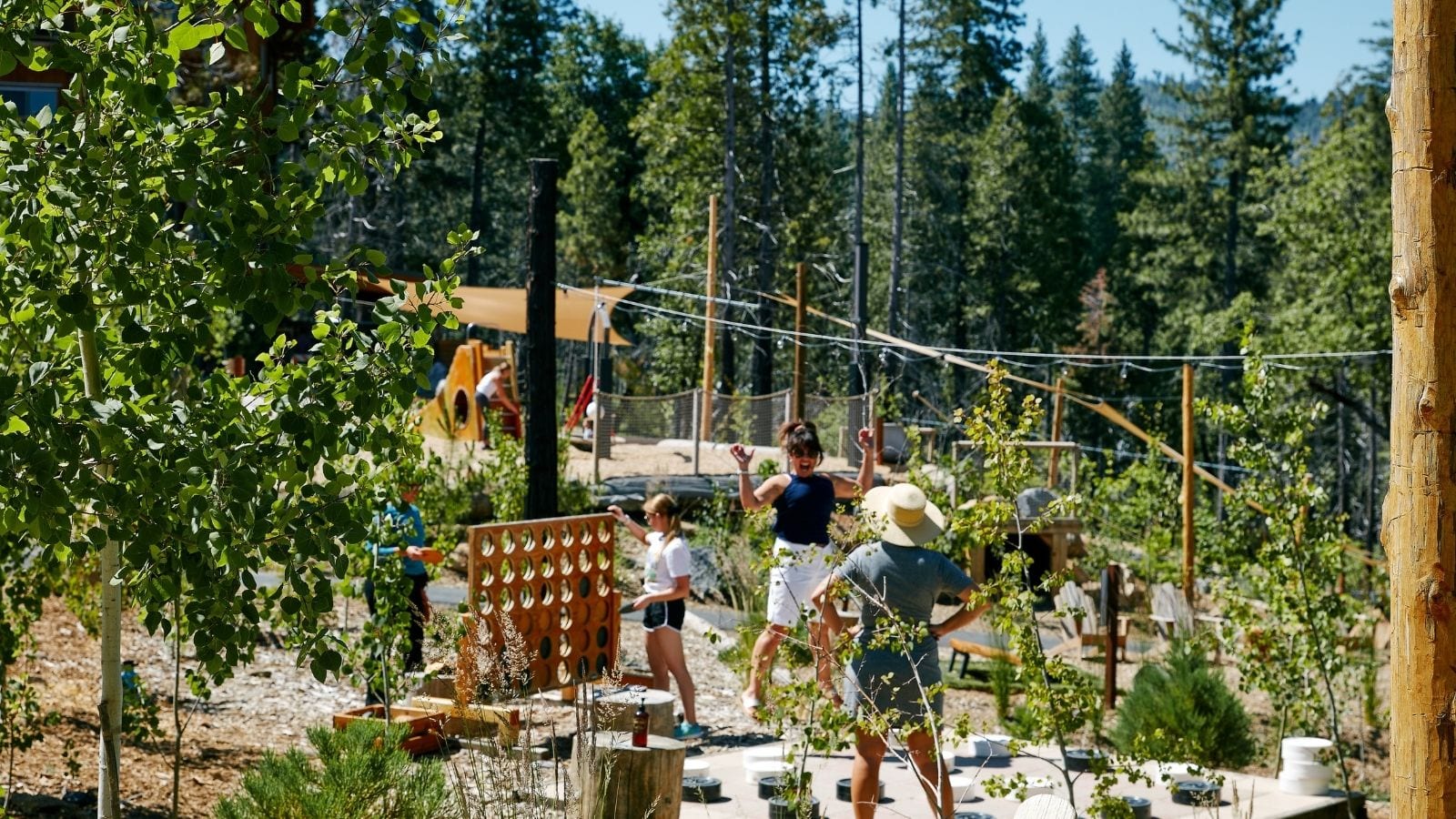 guests playing supersized Connect 4 at Rush Creek Lodge near Yosemite National Park