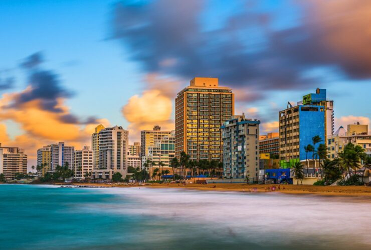 San Juan, Puerto Rico resort skyline on Condado Beach at dusk.