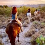 Woman at sunset on horseback in Sonoran Desert, Scottsdale, Arizona (Photo: @jjamhardin via Twenty20)