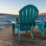 Chairs on a dock on Seneca Lake in New York State, a family vacation destination