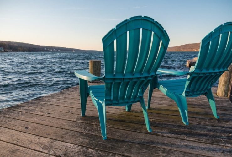 Chairs on a dock on Seneca Lake in New York State, a family vacation destination