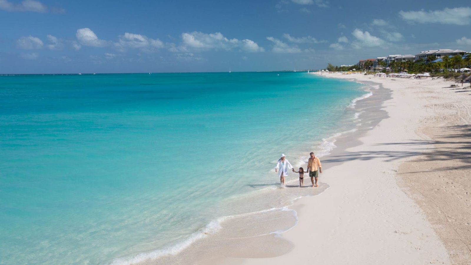 Family walking the beach at Beaches Turks and Caicos