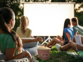 People enjoying an outdoor movie screen (Photo: Shutterstock)