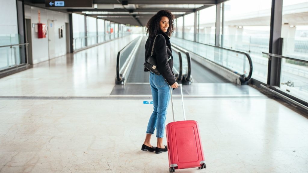 Airport traveler with suitcase (Photo: Shutterstock)