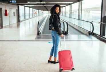 Airport traveler with suitcase (Photo: Shutterstock)