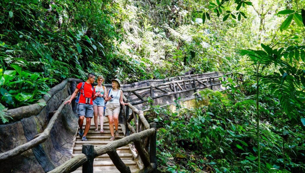 senior citizen and guide walking on a trail in Costa Rica on an Intrepid Premium Tour