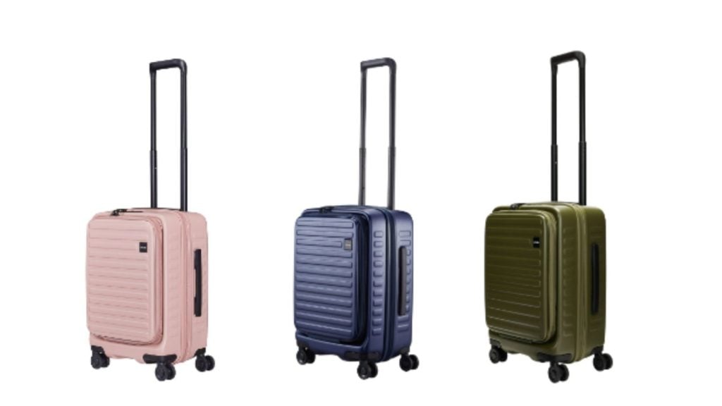 three LOJEL suitcases in pink, blue, and green