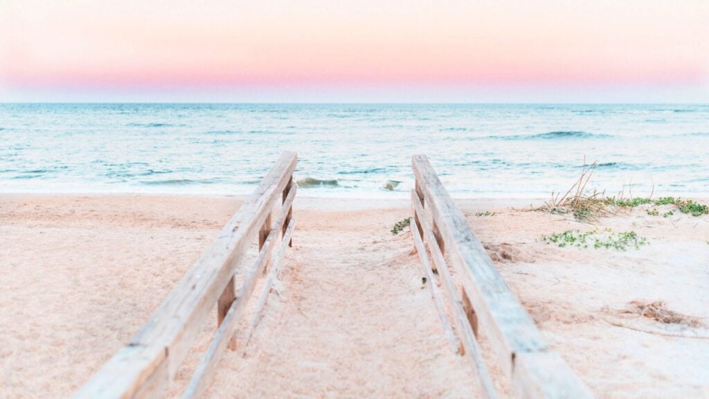 railings leading down to beach at sunset in St. Augustine, Florida