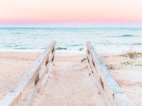 railings leading down to beach at sunset in St. Augustine, Florida