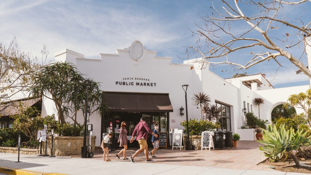 Family walking by the outside of Santa Barbara Public Market