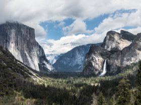 view of Yosemite Valley from Tunnel View overlook, with clouds in background