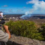 ranger setting up a viewing scope at Volcanoes National Park