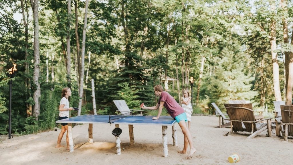 Family playing ping-pong at Hidden Pond Resort (Photo: Hidden Pond)