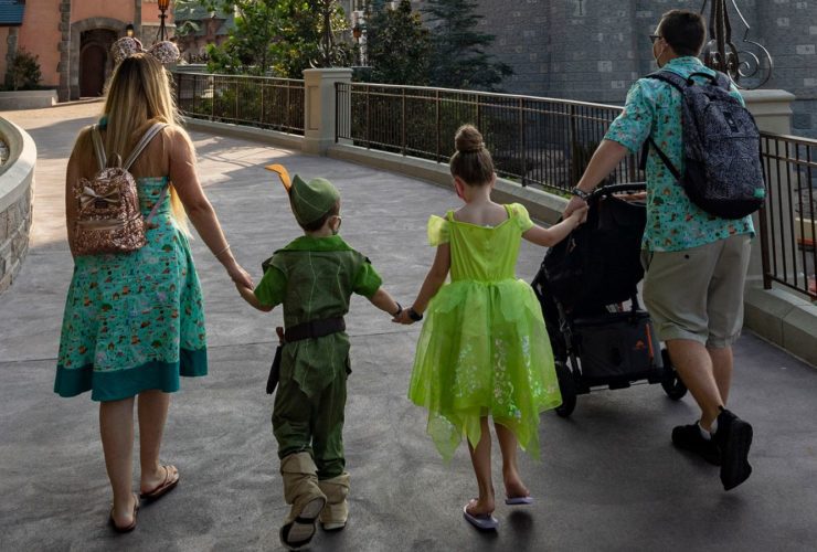 Family walking through Fantasyland near Cinderella's Castle in Magic Kingdom (Photo: Disney)