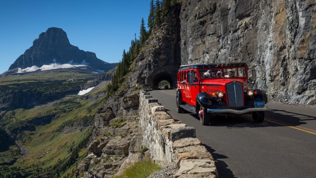 An Iconic red bus inside Glacier National Park (Photo: Xanterra)