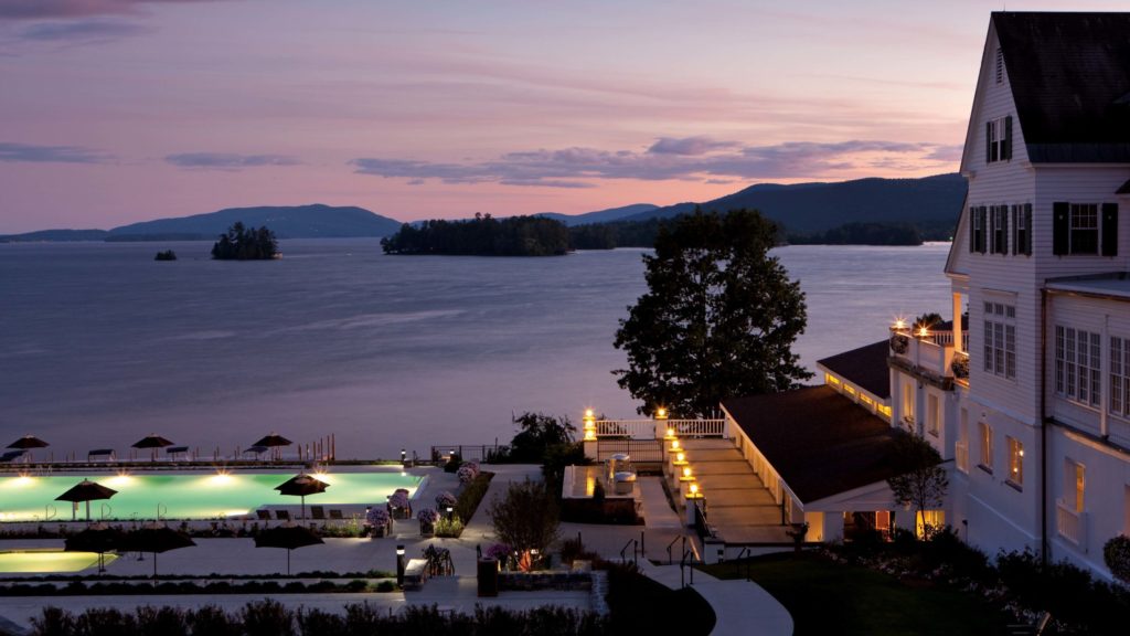 evening with a view of the pool and hotel at The Sagamore Resort on Lake George