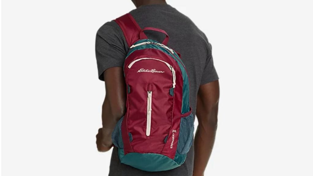 Person wearing Eddie Bauer packable travel backpack