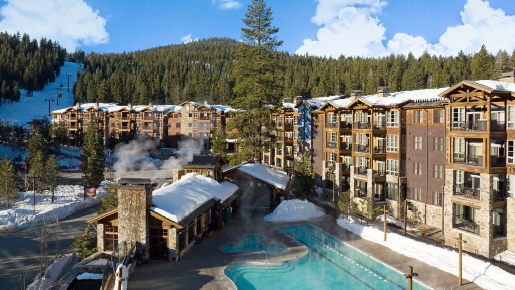 Northstar Lodge exterior with a view of ski slopes and pool
