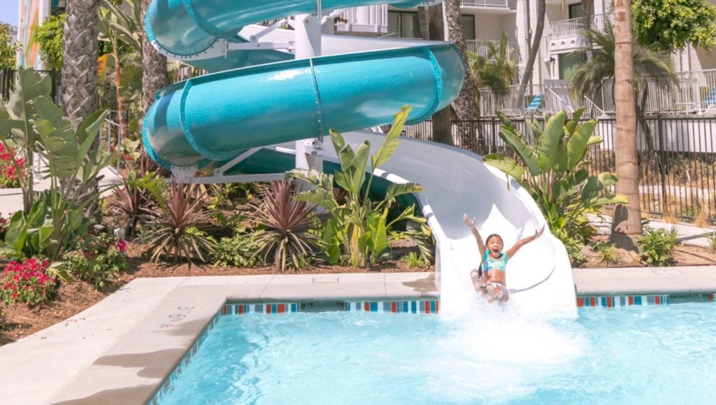 Child going down the waterslide at Town and Country Resort, a San Diego family resort in California