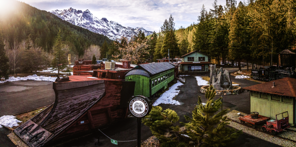 View of Railroad Park Resort in winter with snowy mountains in background