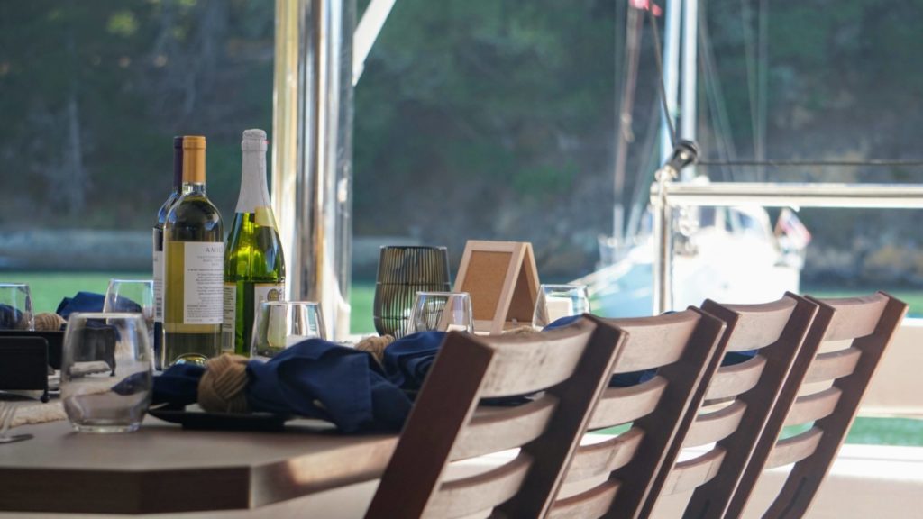 Dining table aboard the BluReverie boat, a romantic California getaway option in the San Francisco Bay