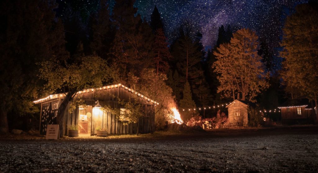 Romantic cabins illuminated by a starry sky at Constellation Creek