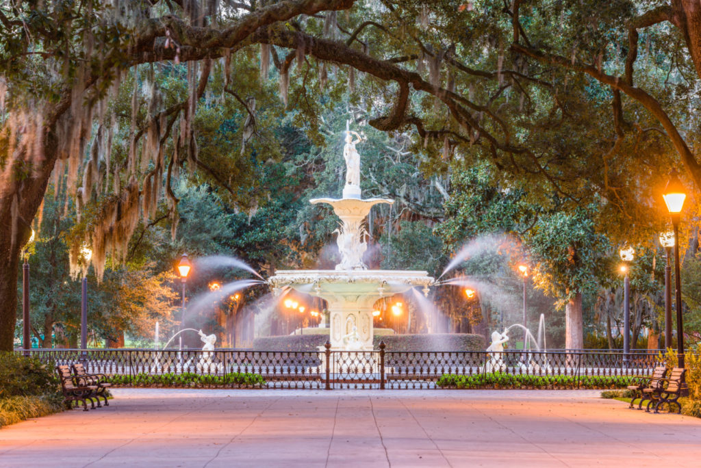 Forsyth Park fountain lit at night in Savannah, Georgia