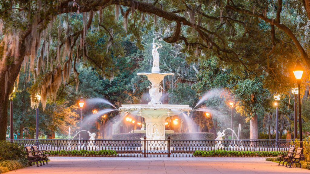 Forsyth Park fountain lit at night in Savannah, Georgia