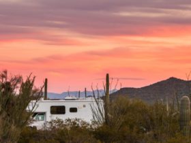 Photo of RV in the desert at sunset for story about RVShare