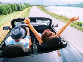 Couple in a convertible rental car (Photo: Shutterstock)