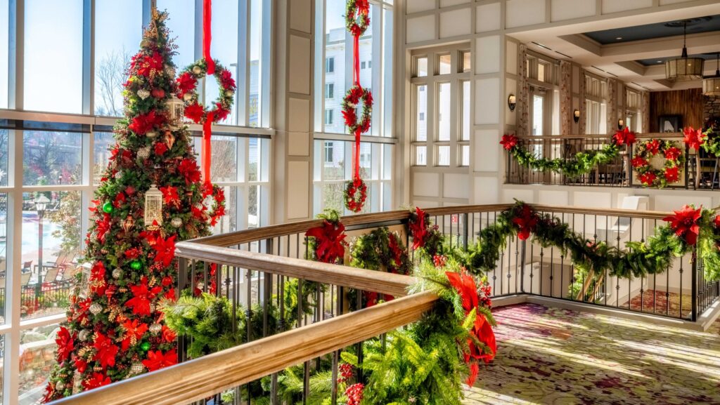 A Christmas tree, wreaths, and garland at Dollywood's DreamMore Resort and Spa